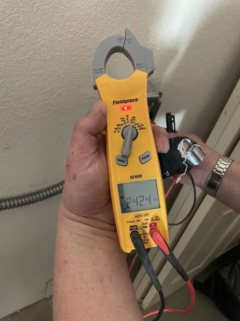 Voltage testing with clamp meter during Whole House Surge Protector in Dodge City